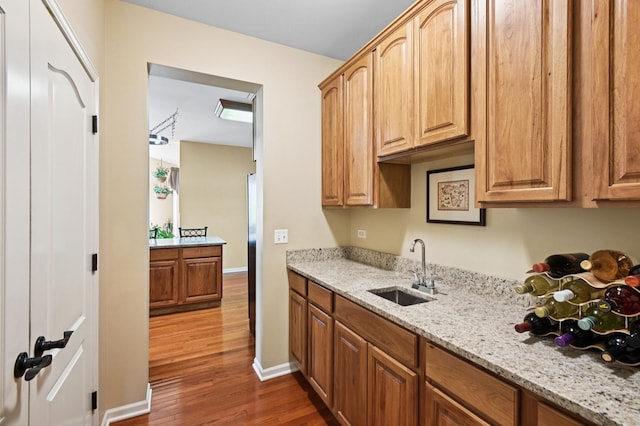 7770 Farrell Dr, Lakewood, IL 60014 - kitchen featuring dark wood-style flooring and light stone countertops