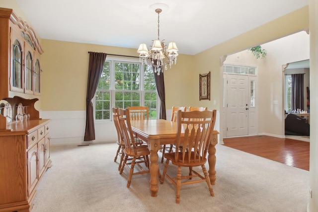 7770 Farrell Dr, Lakewood, IL 60014 - dining room featuring a chandelier and light colored carpet