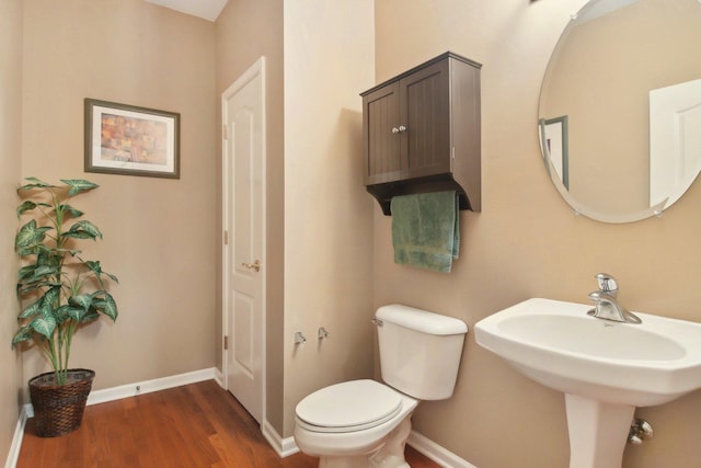 7770 Farrell Dr, Lakewood, IL 60014 - half bathroom featuring wood finished floors and toilet