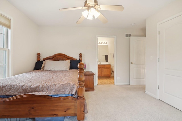 7770 Farrell Dr, Lakewood, IL 60014 - bedroom featuring light colored carpet, ensuite bathroom, and a ceiling fan
