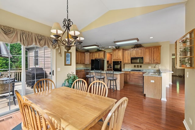 7770 Farrell Dr, Lakewood, IL 60014 - dining area with vaulted ceiling, light wood-type flooring, and a chandelier