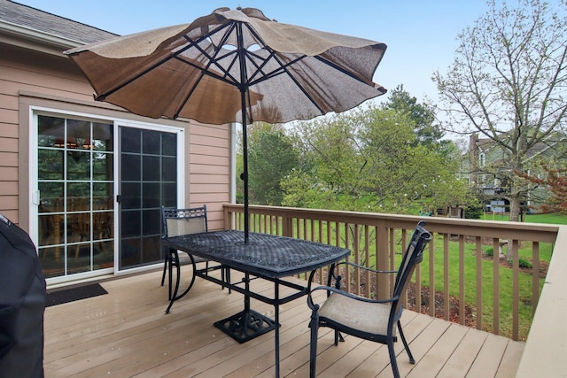 7770 Farrell Dr, Lakewood, IL 60014 - wooden terrace with outdoor dining space and a lawn
