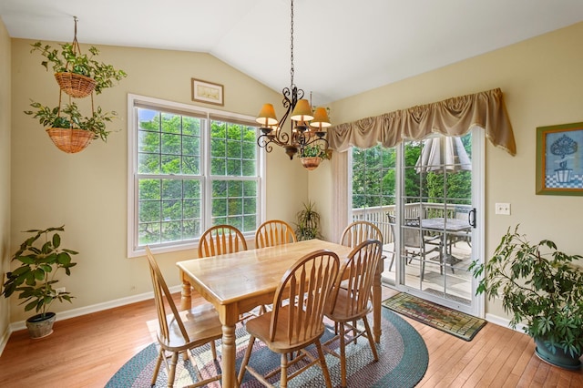 7770 Farrell Dr, Lakewood, IL 60014 - dining room featuring hardwood / wood-style flooring, a chandelier, and lofted ceiling