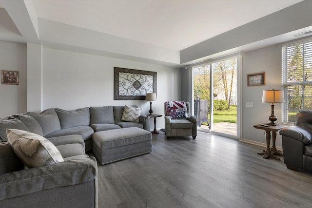 living area with wood finished floors and baseboards