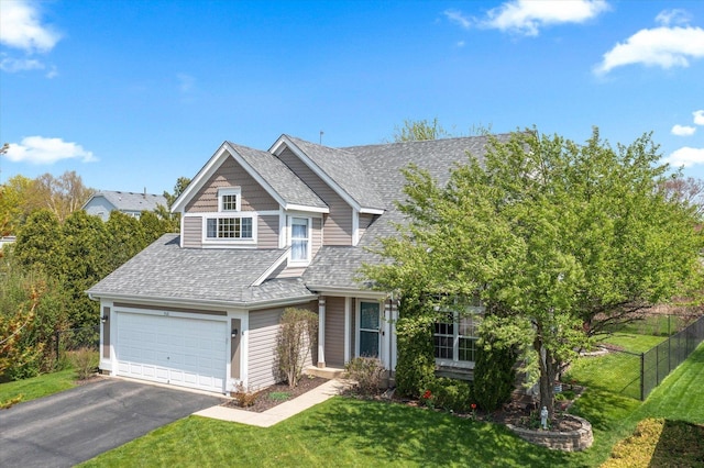 968 N Lancaster Cir S, Elgin, IL 60177 - view of front of home featuring fence, a shingled roof, driveway, and a front yard
