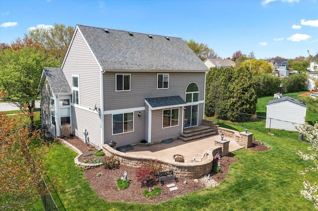 968 N Lancaster Cir S, Elgin, IL 60177 - back of property featuring a patio area, fence, an outdoor fire pit, a yard, and a shingled roof