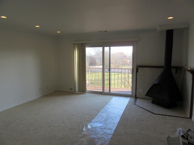 733 Limerick Ln Unit 3D, Schaumburg, IL 60193 - unfurnished room with carpet flooring, recessed lighting, and a wood stove