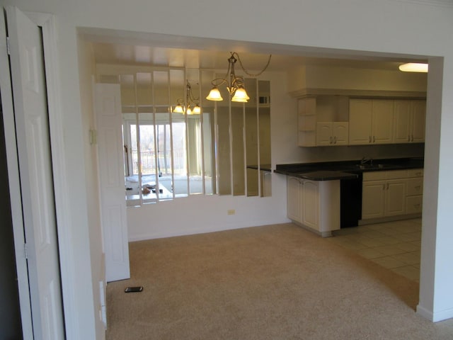 733 Limerick Ln Unit 3D, Schaumburg, IL 60193 - kitchen featuring light carpet, dark countertops, a chandelier, a sink, and open shelves
