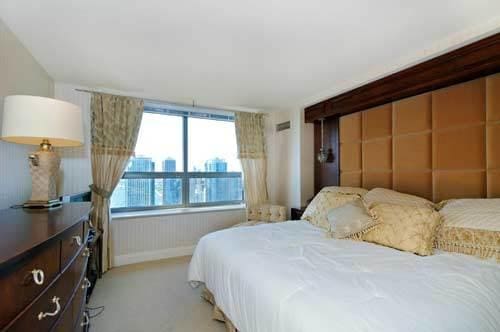 474 N Lake Shore Dr Unit 4808, Chicago, IL 60611 - bedroom with baseboards and light carpet