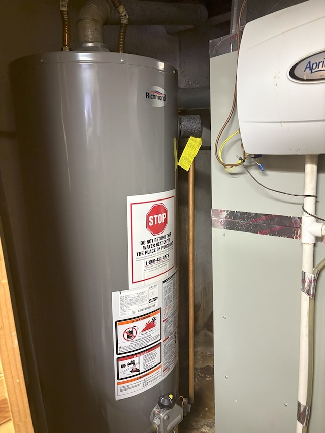 utility room featuring gas water heater