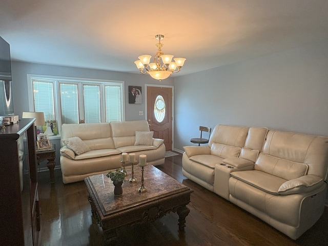 living room featuring wood finished floors and a notable chandelier