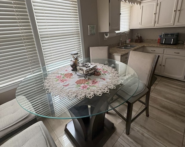 kitchen with light stone countertops and a sink