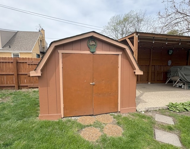 view of shed with fence