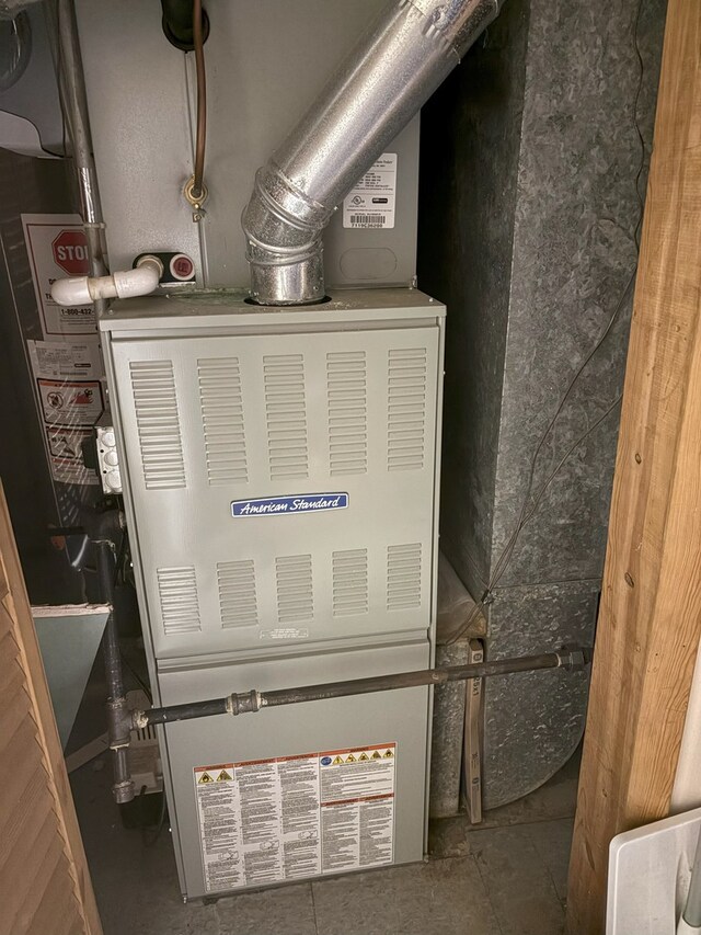utility room with heating unit