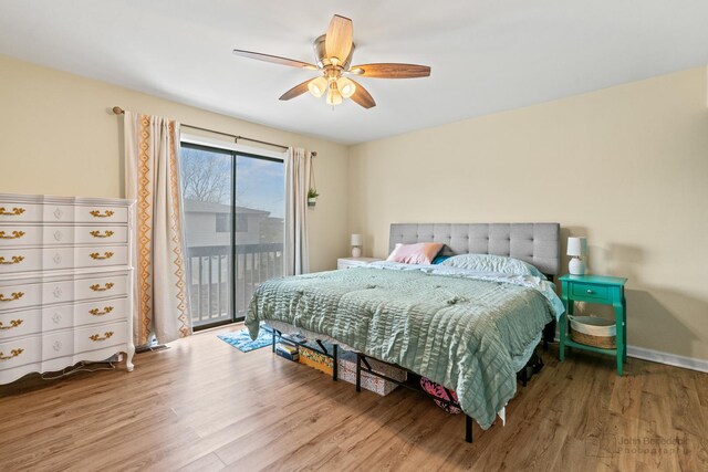 bedroom with baseboards, ceiling fan, wood finished floors, and access to exterior