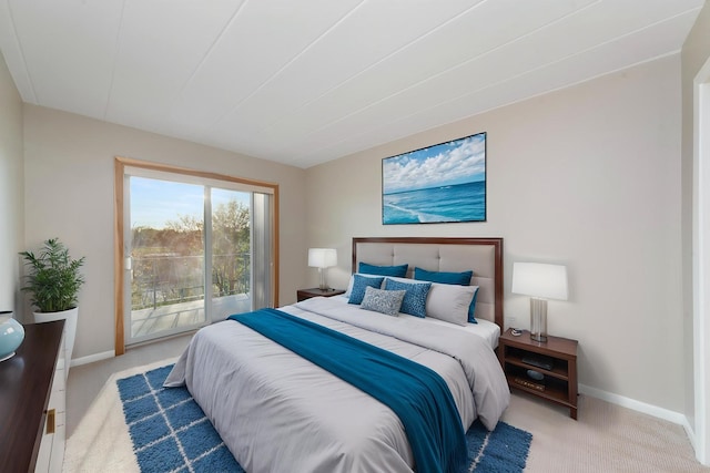 carpeted bedroom featuring access to outside and baseboards
