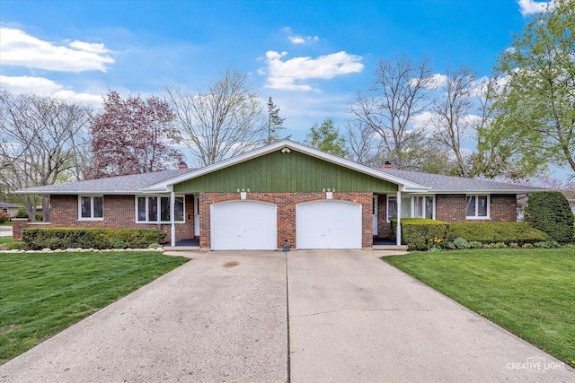 ranch-style home with a front lawn, brick siding, driveway, and a garage