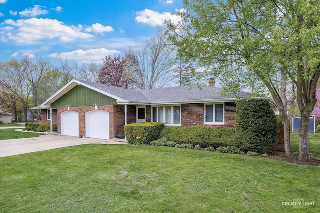 single story home featuring an attached garage, concrete driveway, brick siding, and a front lawn