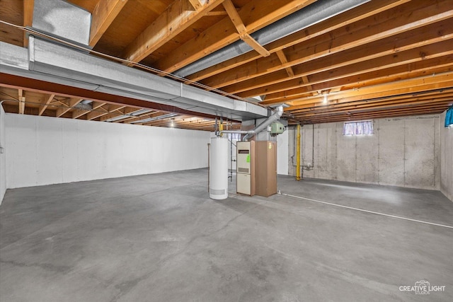 basement featuring heating unit and gas water heater