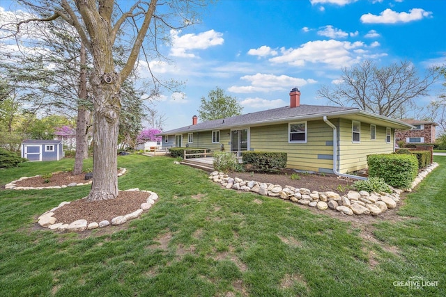 exterior space featuring a deck, an outbuilding, and a storage unit
