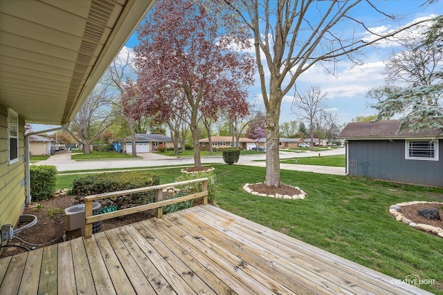 wooden deck with a lawn and a residential view