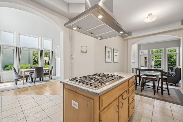 874 W Goodrich Pl, Palatine, IL 60067 - kitchen with arched walkways, stainless steel gas stovetop, ventilation hood, light tile patterned flooring, and recessed lighting