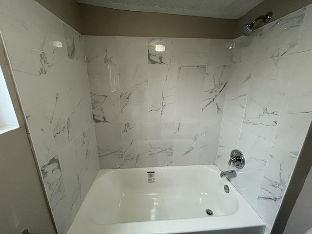 full bathroom featuring  shower combination