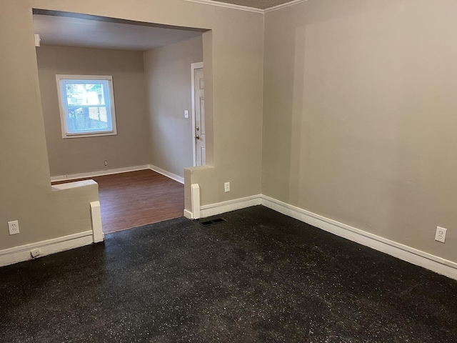 spare room with visible vents and baseboards