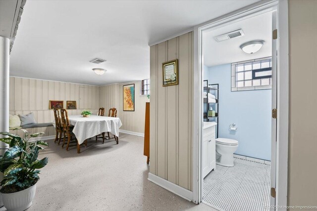 interior space featuring baseboards and visible vents