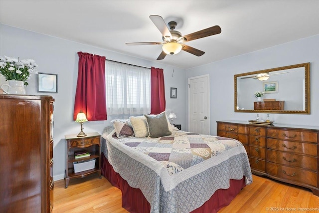 bedroom featuring ceiling fan and light wood-style flooring