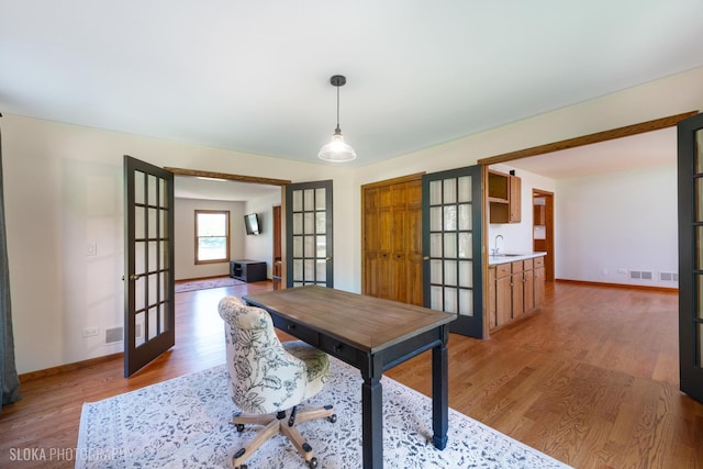 1 Byron Ct, Hawthorn Woods, IL 60047 - office with french doors, light wood finished floors, baseboards, and a sink