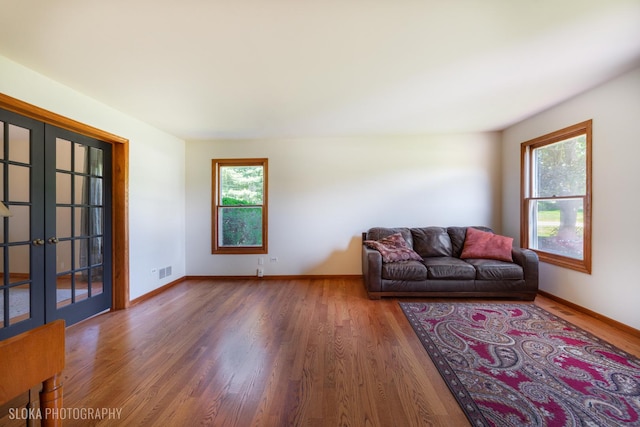 1 Byron Ct, Hawthorn Woods, IL 60047 - living room featuring french doors, wood finished floors, and baseboards