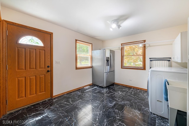 1 Byron Ct, Hawthorn Woods, IL 60047 - laundry area featuring baseboards, plenty of natural light, washer / clothes dryer, and dark marble finish floors
