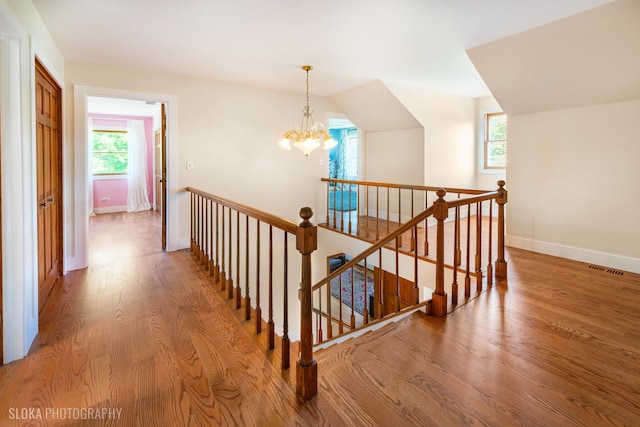 1 Byron Ct, Hawthorn Woods, IL 60047 - stairs featuring wood finished floors, healthy amount of natural light, a chandelier, baseboards, and lofted ceiling