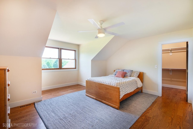 1 Byron Ct, Hawthorn Woods, IL 60047 - bedroom featuring lofted ceiling, wood finished floors, baseboards, a ceiling fan, and a spacious closet