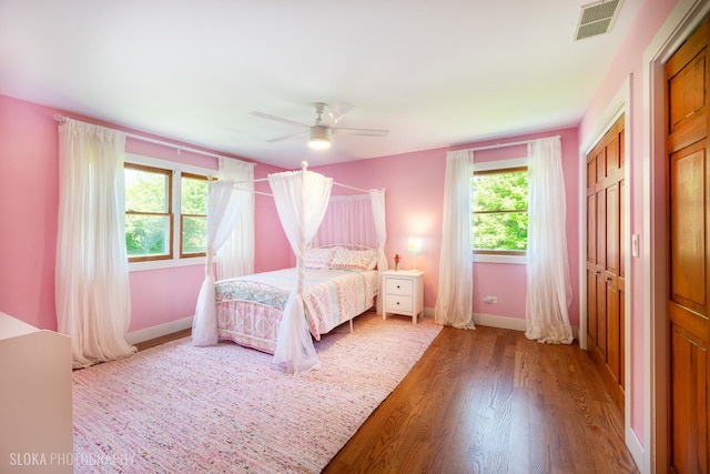 1 Byron Ct, Hawthorn Woods, IL 60047 - bedroom featuring wood finished floors, multiple windows, baseboards, and a ceiling fan