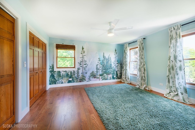 1 Byron Ct, Hawthorn Woods, IL 60047 - empty room featuring wood finished floors, plenty of natural light, and baseboards