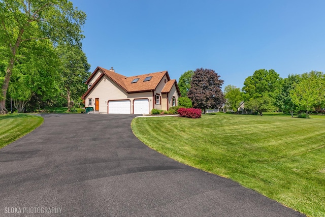 1 Byron Ct, Hawthorn Woods, IL 60047 - view of front of house featuring an attached garage, a front yard, a chimney, asphalt driveway, and roof mounted solar panels