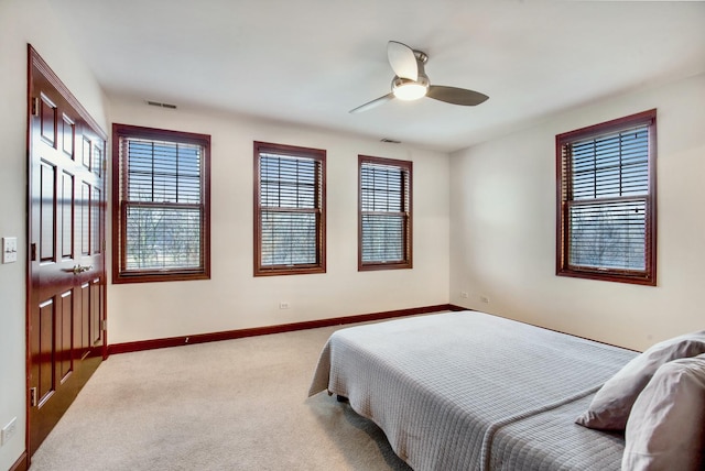 5912 N NW Hwy, Chicago, IL 60631 - carpeted bedroom with multiple windows, baseboards, and a ceiling fan