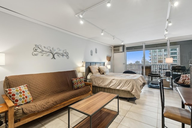 bedroom with ornamental molding, light tile patterned flooring, access to exterior, a wall mounted AC, and rail lighting