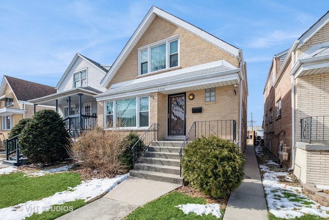 6004 S Kolmar Ave, Chicago, IL 60629 - bungalow-style house with covered porch and brick siding