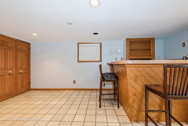 6004 S Kolmar Ave, Chicago, IL 60629 - bar featuring recessed lighting, a dry bar, baseboards, and light tile patterned floors