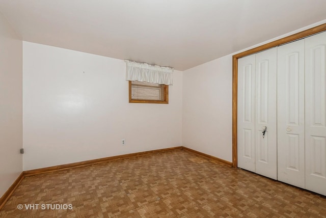 6004 S Kolmar Ave, Chicago, IL 60629 - unfurnished bedroom featuring parquet floors, baseboards, and a closet