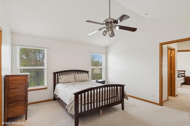 bedroom with carpet floors, visible vents, baseboards, ceiling fan, and vaulted ceiling