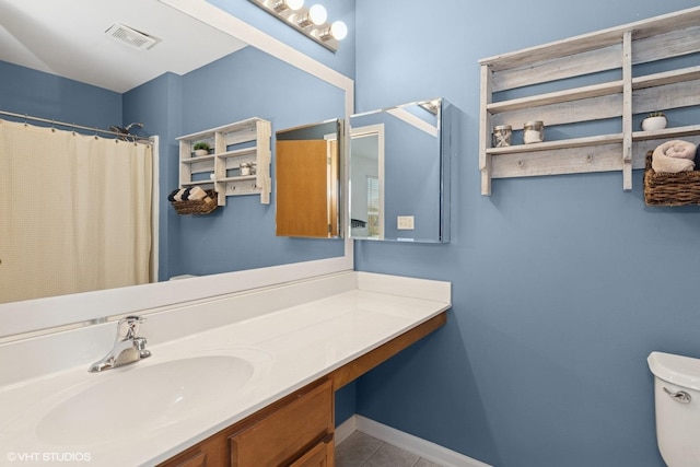 full bathroom with vanity, visible vents, toilet, baseboards, and tile patterned floors