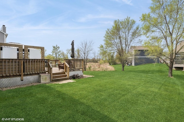 view of yard with a deck