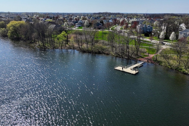 drone / aerial view featuring a residential view and a water view