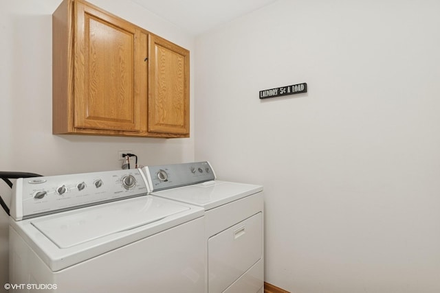 laundry room with cabinet space and independent washer and dryer