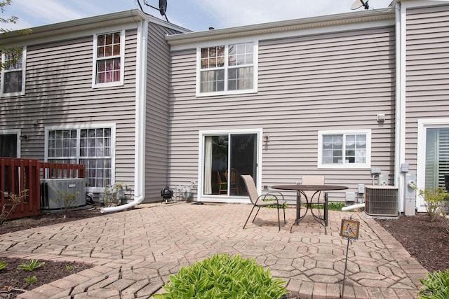 back of property featuring a patio and central AC unit