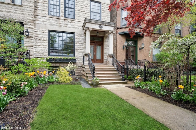 2535 N Burling St, Chicago, IL 60614 - view of exterior entry with french doors, a yard, and stone siding